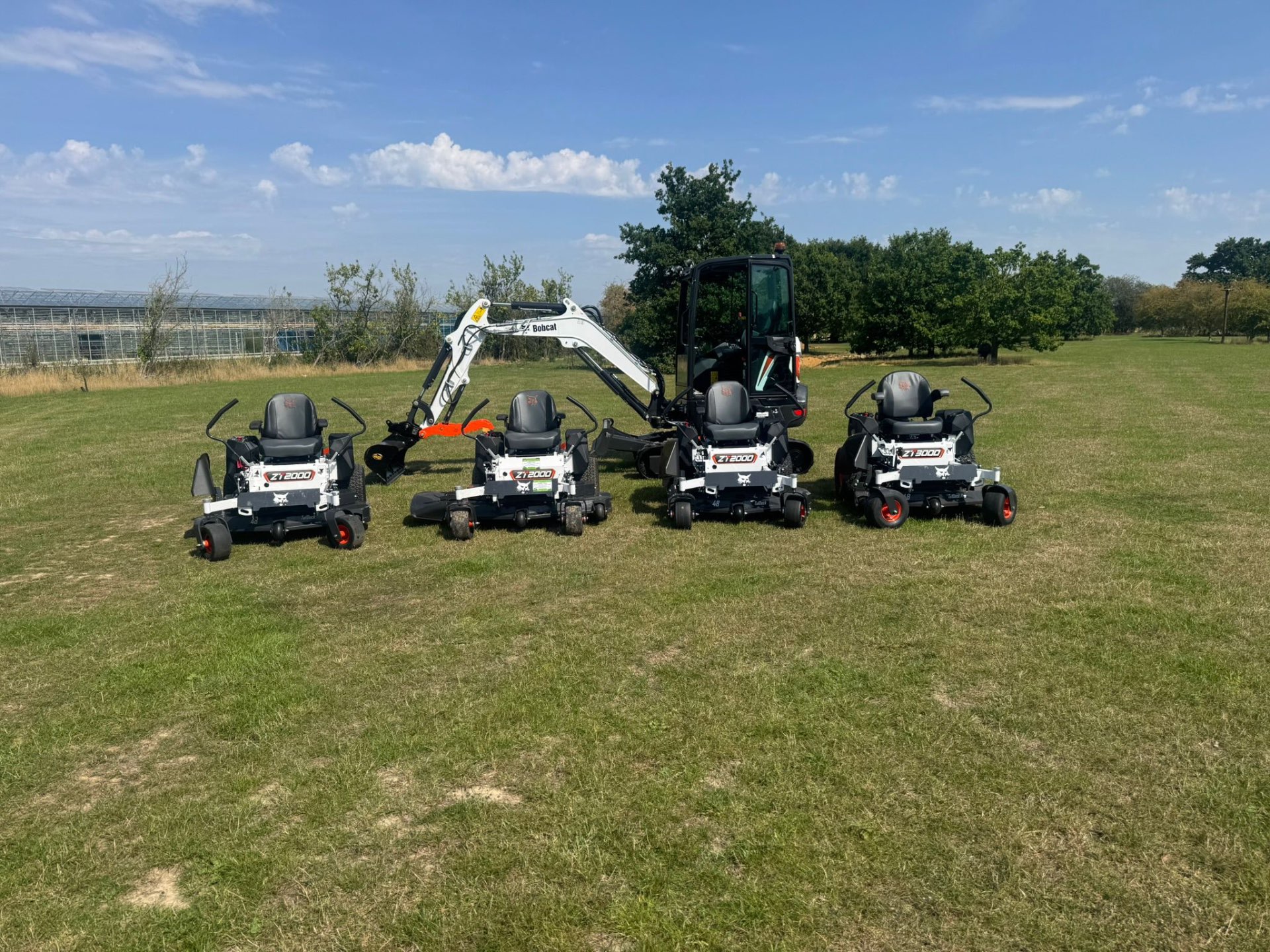 Line-up of Bobcat mowers and excavator looked after by DJW